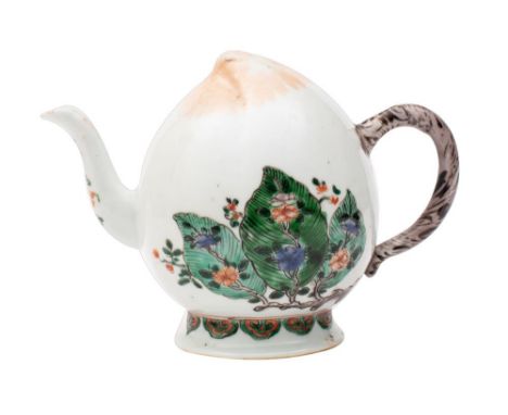 A Chinese famille verte 'Cadogan' teapot modelled in the form of a peach, painted with two peony branches and overlapping lea