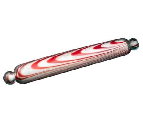 A 'Bristol' glass rolling pin, the clear body with red glass striations, 38cm long.