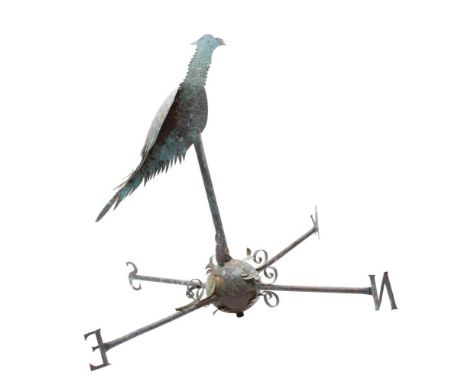 A copper weather vane, in the form of a pheasant mounted on a sphere base with cardinal points, 75cm high. 