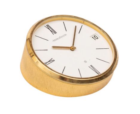 Jaeger-LeCoultre a gilt-brass desk timepiece, having an eight-day duration timepiece movement, the round white dial with blac