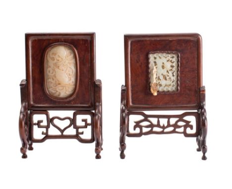 A Chinese miniature table top screen of rectangular outline inset with an oval carved jade panel depicting carp, 21cm high to