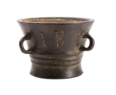 A late 16th century bronze mortar of traditional cylindrical tapering form, with three loop handles to the sides, initialled 