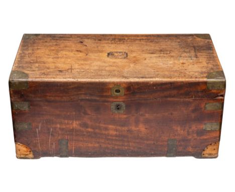 An Anglo Indian sandalwood trunk, last quarter 19th century; the hinged cover with inset brass corner protectors and a recess