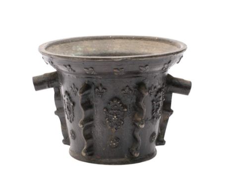 A late 17th century bronze French mortar of traditional design, with banded fleur d'lys and lion mask decoration, with two re