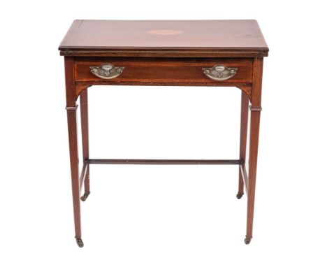 An Edwardian mahogany and inlaid enclosed writing table, early 20th century;  the top with central floral patera, hingeing op