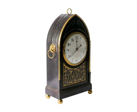 An ebonised Georgian mantel clock having an eight-day duration single-fusee timepiece movement, the round white enamel dial w