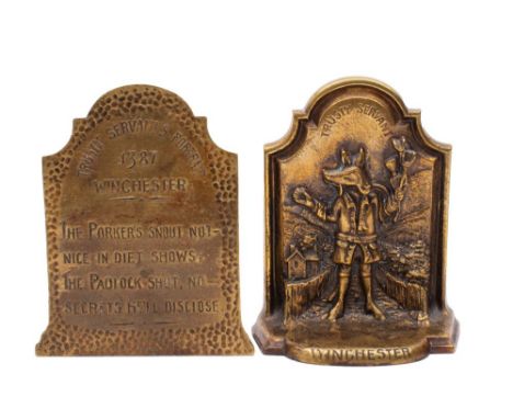 A pair of relief cast brass Trusty Servant bookends, early 20th century; each with WINCHESTER inscribed across the bowed base