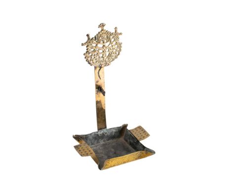 An 18th century brass crusie lamp probably Dutch, with pierced tree of life medallion on a rectangular backplate on a square 