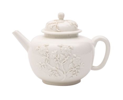 A rare Meissen Böttger white teapot and cover of globular form with domed cover and pierced finial, applied with flowering ch