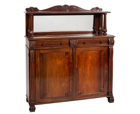 A George IV goncalo alves chiffonier, circa 1825; the back gallery carved with lobed cresting flanked by scrolling; above a s