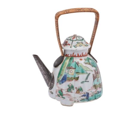 A Chinese famille verte teapot and cover of lobed form, painted to one side with fishermen on a lake, the other with birds fe