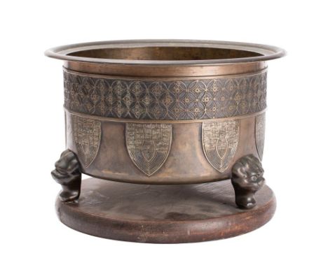 A Chinese  bronze jardiniere of circular outline  with banded trellis decoration with suspended shields with geometric decora