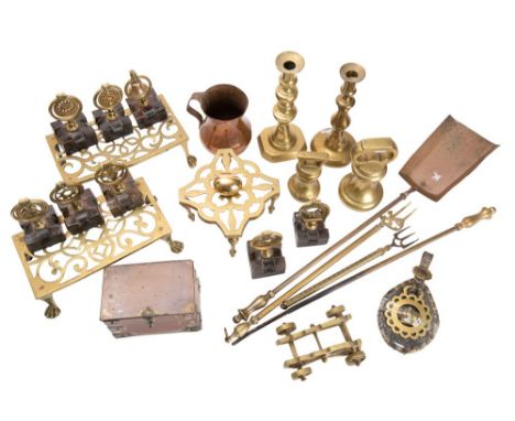 A mixed collection of brass and copper wares including;- candlesticks, trivets, horse brasses, caddy, jug and weights. (a lot