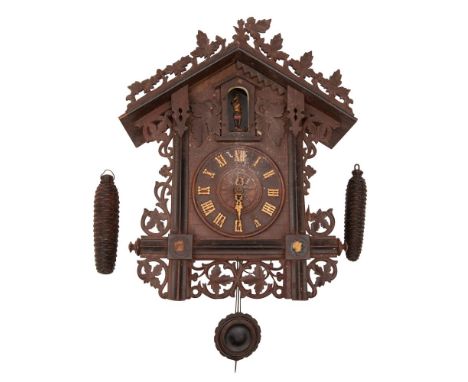 A Victorian Black Forest trumpeter wall clock, the eight-day duration movement striking the hours on a gong with a trumpeter 