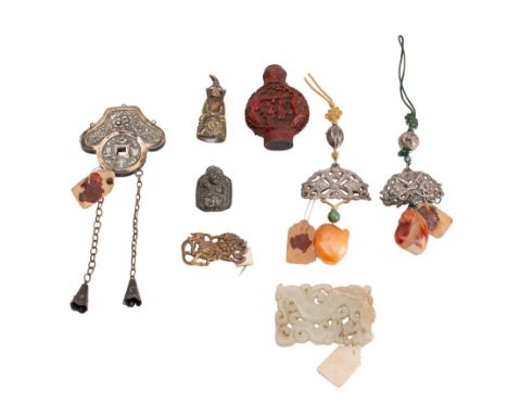 A small carved and pierced jade panel with dragon decoration and seal, a cinnabar lacquer scent bottle, a cast bronze seated 