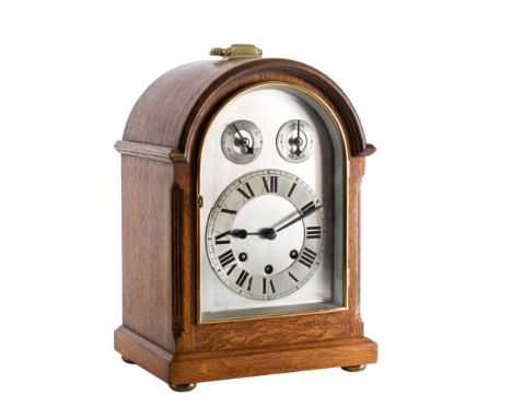 An Edwardian oak Westminster chiming mantel clock,  the eight-day duration movement striking the hours on a gong and the quar