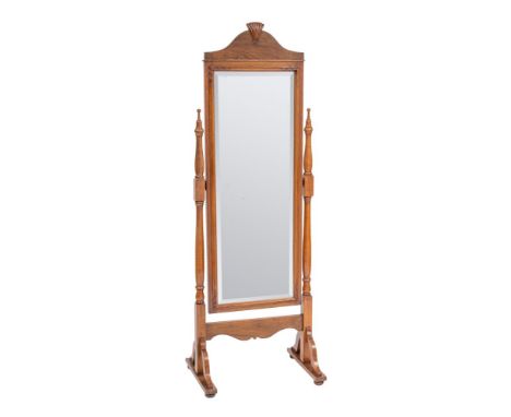 An Edwardian walnut cheval mirror, early 20th century; the bevelled rectangular plate with stylised carved shell cresting; in
