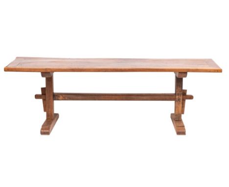 An oak refectory trestle table, 19th century; with cleated top above twin bearers; each on a simple straight rectangular sect