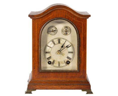 Winterhalder & Hoffmeier, Sch., an oak quarter chiming mantel clock,  the eight-day duration movement striking the hours on a