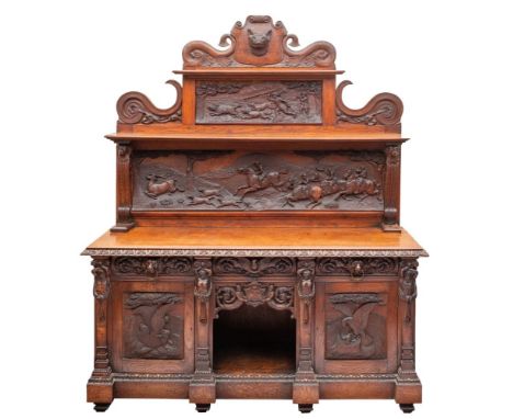 A Victorian carved oak sideboard in 17th century taste, late 19th century; the superstructure with central fox mask cresting 