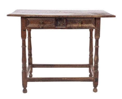 A William and Mary oak side table, late 17th century; the top with ovolo moulded front and side edges, above a twin panel fro