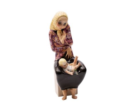 A Lenci earthenware figure 'La Maternita' by Helen König Scavini the mother seated with her baby and a small bird in her lap,