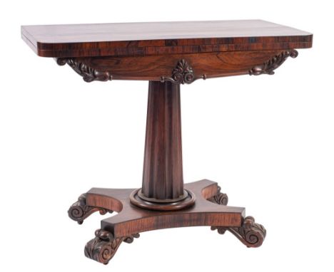 A George IV rosewood card table, circa 1825; the revolving hinged rectangular top opening to a baize lined interior; the fron