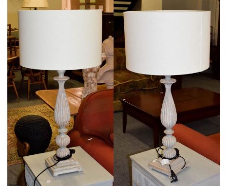 A modern pair of large wooden table lamps, as light grey distressed effect reeded balusters on square bases, 63cm high, toget