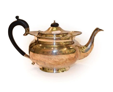 A George V silver teapot by Henry Wilkinson and Co, London, 1917, with hardwood handles and final, 27cm wide over handle, gro