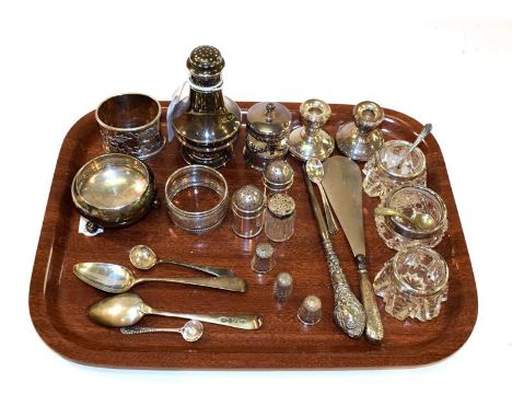 A collection of assorted silver, including a pepperette, two differing napkin-rings, two small pepperettes, a salt-cellar; va