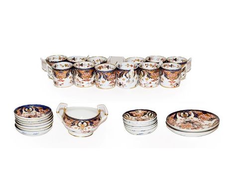 A tray of 19th century Derby coffee wares, decorated in the Imari palette, comprising; twelve coffee cans, thirteen saucers, 