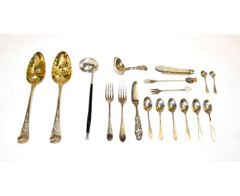 A collection of assorted silver flatware, including a pair of George III silver tablespoons, later decorated as berry spoons,