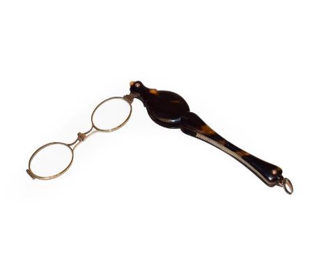 A pair of Victorian tortoiseshell cased lorgnette with spring action, inlaid with a plain yellow metal cartouche, 15cm