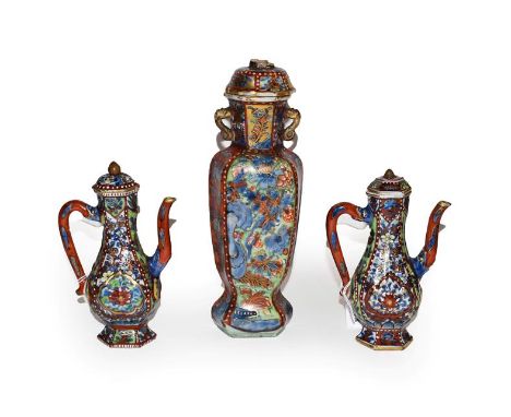 A pair of 18th century Chinese wine ewers with covers and similar hexagonal jar and cover, originally blue and white with lat