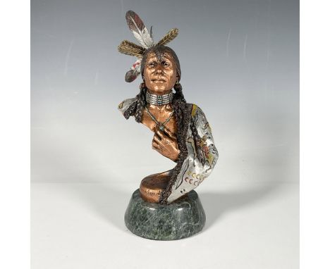 This pewter and bronze figurine by Christopher Pardell depicts an elderly Native American man, grasping a pendant around his 