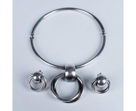 Gorgeous set that consists of a choker styled necklace 5.5" dia. with a circular pendant, and a pair of matching earrings 1.2