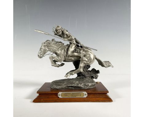 A captivating pewter figurine depicts a Native American Cheyenne warrior on horseback, poised with a spear in hand as he read