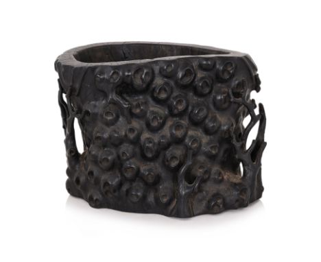 A HARDWOOD SCROLL POT
Carved hardwood in naturalistic burl form, and branches to sides, inset plug base
27 x 38 x 24cm
From t