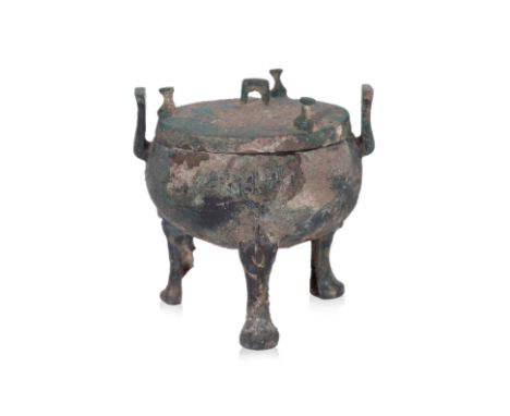 A SMALL BRONZE RITUAL FOOD VESSEL AND COVER, DING Zhou-Han dynasty, compressed globular form cauldron decorated in key fret b
