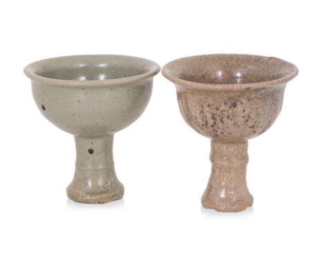 TWO CELADON GLAZED STEM CUPS
Yuan-Ming dynasty, of similar bell-shaped form with banded stem base, one example covered in gre