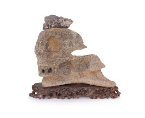 A LARGE CARVED STONE BUDDHA CAVE GROTTO
Chinese, hardstone with deep relief carved grottos, eleven of which show Buddha in a 