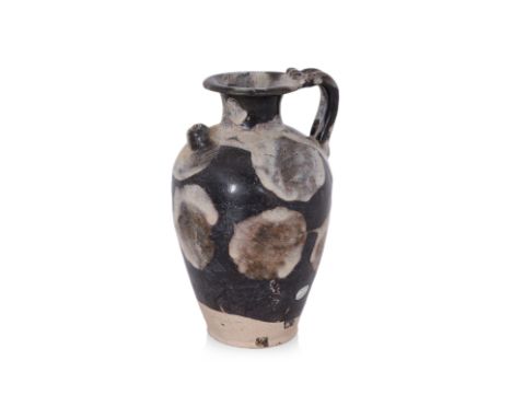 A LUSHAN PHOSPHATIC-SPLASHED BLACK-GLAZED EWER Tang dynasty, tapering body with rounded shoulders and everted rim, short coni