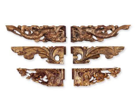 THREE PAIRS OF CARVED GILTWOOD MOUNTS
Comprising a pair of dragon examples; a pair with phoenix and flowers; and a pair of fo