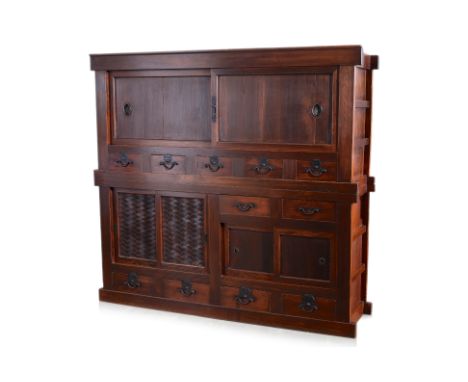 A JAPANESE TWO SECTION MIZUYA TANSU CABINET
19th century,  the upper portion with a pair of sliding doors, each handle inset 