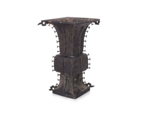 A LARGE ARCHAISTIC BRONZE GU FORM VASE Circa 18th century, square form with barbed corners and everted rim, decorated in taot