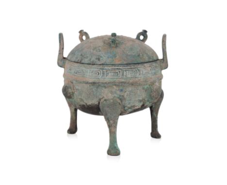 A SMALL BRONZE RITUAL FOOD VESSEL AND COVER, DING Zhou-Han dynasty, globular cauldron with two upright loop lugs, decorated i