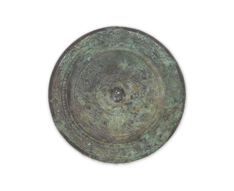 A BRONZE 'TLV' MIRROR
Han dynasty, circular mirror with geometric pattern to interior, triangular and wave borders
18cm diame