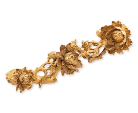 A CARVED GILTWOOD PEONY BLOSSOM BRANCH
Loosely in the form of a ruyi sceptre, the naturalistic carving with three large flowe
