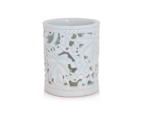 A KOREAN RETICULATED WHITE-GLAZED 'GRAPEVINES' BRUSH POT
Joseon dynasty, 18th/19th century, cylindrical brush pot with reticu