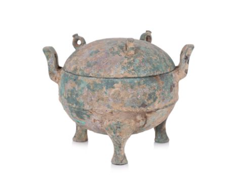 A BRONZE RITUAL FOOD VESSEL, DING Late Zhou dynasty, globular cauldron with three loop lugs to cover, thickly cast upright ha